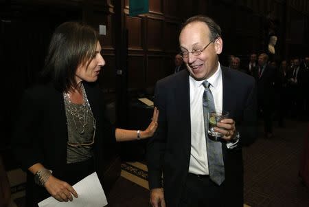 Attorney Lisa Blatt (L) congratulates fellow attorney Paul Clement on his 75th argument before the United States Supreme Court at a party held to celebrate the achievement in Washington October 15, 2014. REUTERS/Yuri Gripas