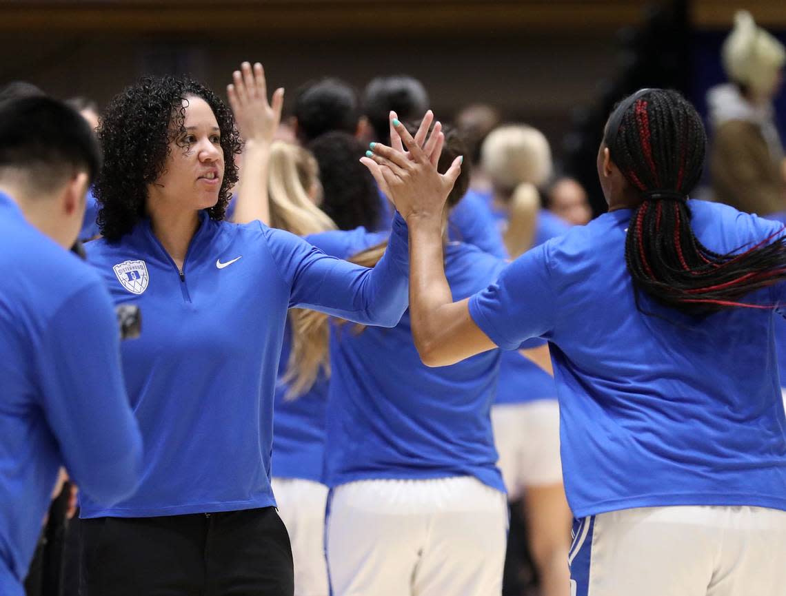 Duke head coach Kara Lawson high-fives players prior to the Blue Devils’ final regular season game against North Carolina on Sunday, Feb. 26, 2023, at Cameron Indoor Stadium in Durham, N.C.