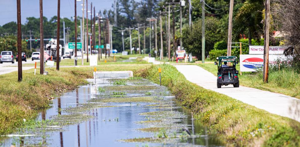 A golf cart is used for transportation along U.S. 41 in North Fort Myers on Friday, Sept. 9, 2022.  