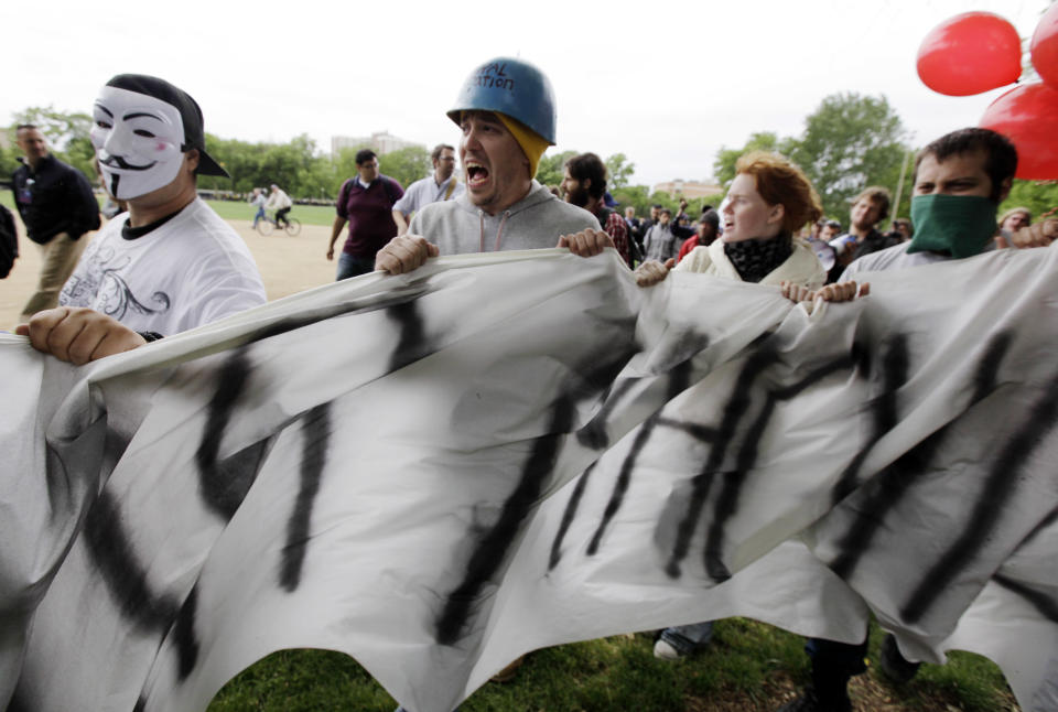 Protesters leave Union Park, in Chicago on a march to Boeing corporate offices for a demonstration as a part of the NATO summit Monday, May 21, 2012 in Chicago. Demonstrators prepared Monday to launch another round of protests in the final hours of the NATO summit, a suburban community that could become the site of a detention facility to hold illegal immigrants.    (AP Photo/Nam Y. Huh)