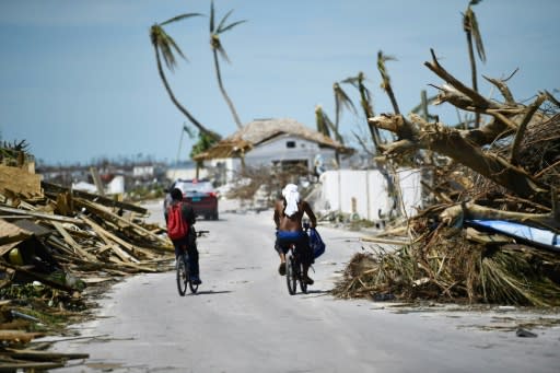 As far as the eye can see, buildings have been reduced to splintered wood, trees stripped of their branches