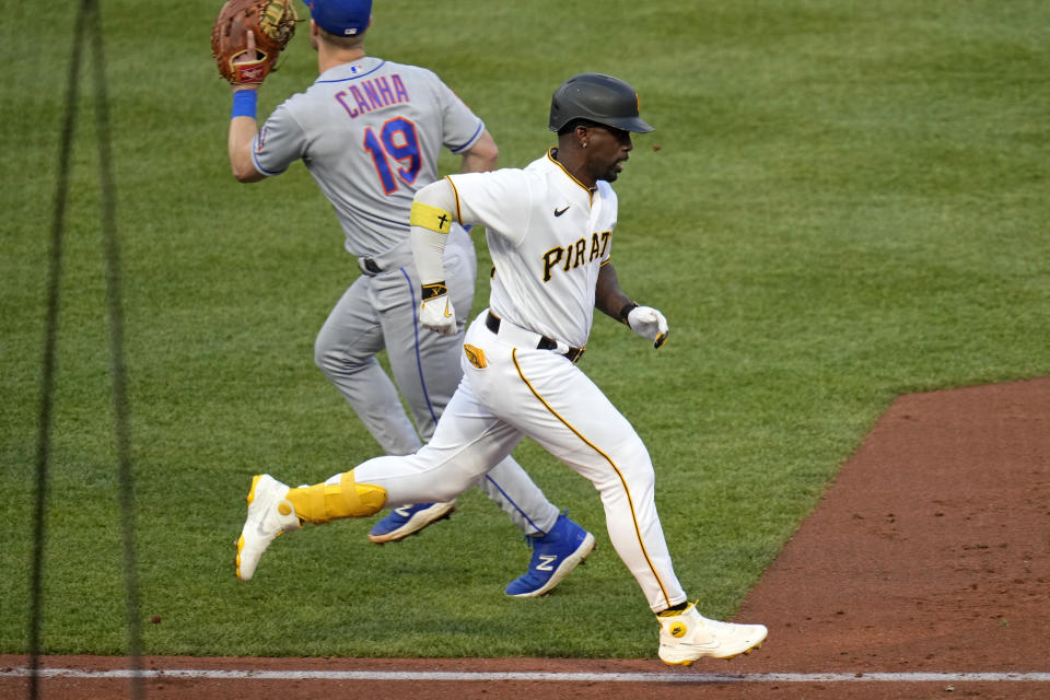 Pittsburgh Pirates' Andrew McCutchen beats out an infield single during the third inning of the team's baseball game against the New York Mets in Pittsburgh, Friday, June 9, 2023. (AP Photo/Gene J. Puskar)
