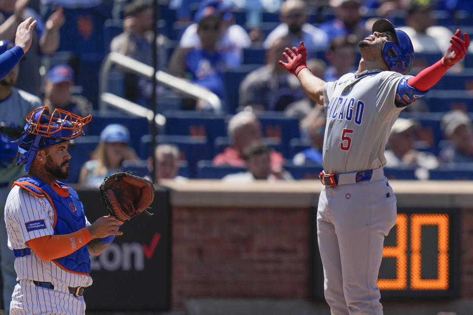 New York Mets catcher Omar Narváez, left, watches as Chicago Cubs' Christopher Morel crosses home plate after hitting a three-run homer during the fifth inning of a baseball game at Citi Field, Thursday, May 2, 2024, in New York. (AP Photo/Seth Wenig)