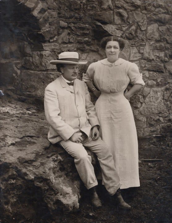 Pawnee Bill and his wife in front of their mansion, 1911.