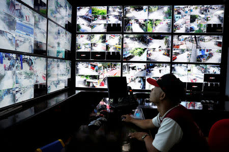 Barangay workers monitor CCTV video monitors at Barangay Bagong Silangan office, in Quezon City, Metro Manila, Philippines November 22, 2017. REUTERS/Erik De Castro