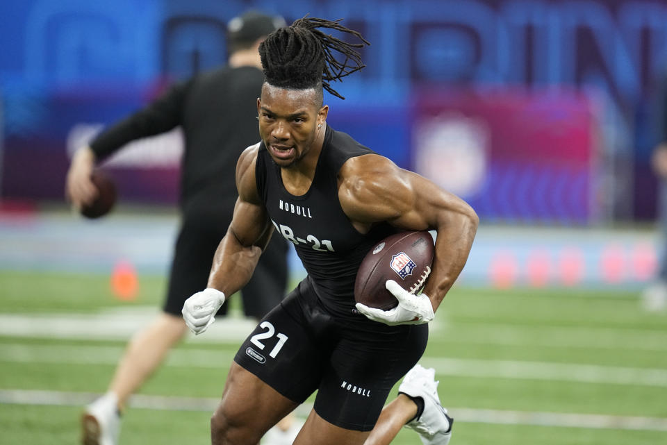 FILE - Texas running back Bijan Robinson runs a drill at the NFL football scouting combine in Indianapolis, Sunday, March 5, 2023. Bijan Robinson ranks among the best overall prospects in the NFL draft. (AP Photo/Darron Cummings, File)