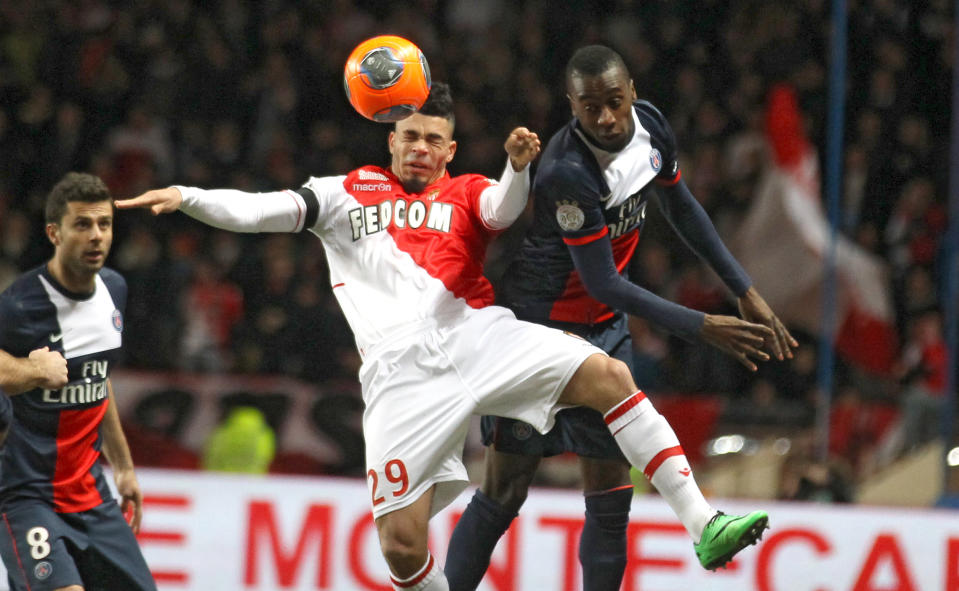 Monaco's Emmanuel Riviere of France, left, challenges for the ball with Paris Saint Germain's Blaise Matuidi of France during their French League One soccer match, in Monaco stadium, Sunday, Feb. 9 , 2014. (AP Photo/Lionel Cironneau)