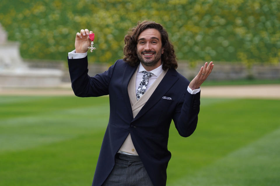 RETRANSMITTING AMENDING AWARD GIVER TO THE PRINCESS ROYAL Joe Wicks after receiving his MBE medal from the Princess Royal during an investiture ceremony at Windsor Castle. Picture date: Wednesday March 30, 2022.