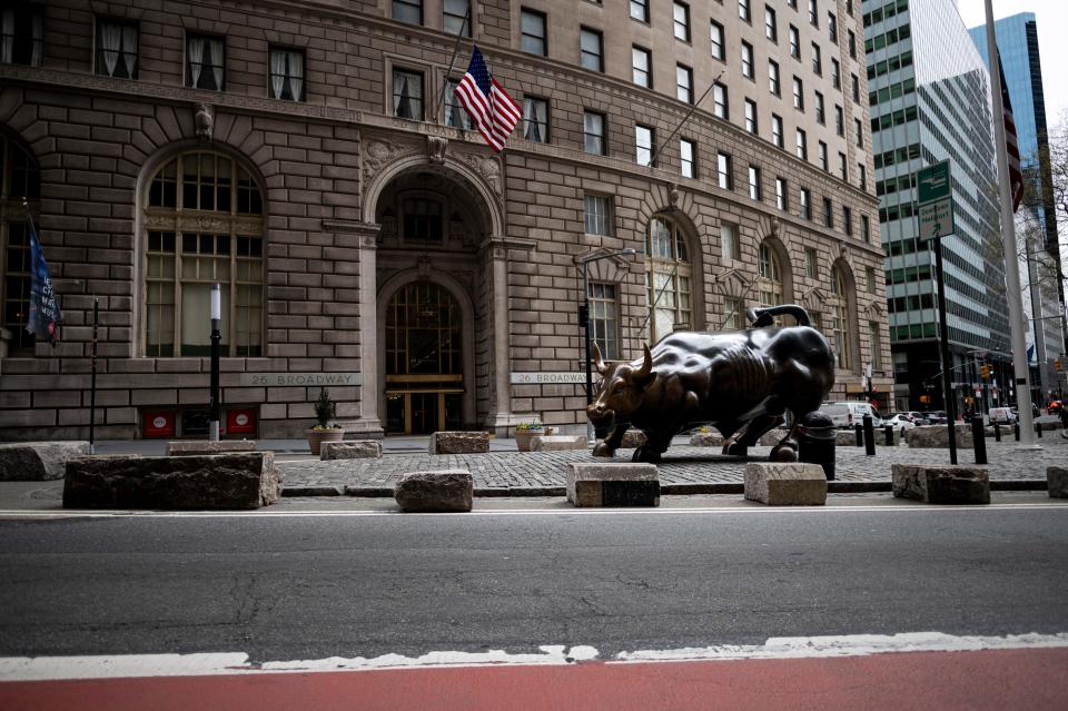 The statue of the charging bull  is pictured on April 20, 2020 in New York City. - Wall Street opened lower on Monday as traders grappled with a drop in oil prices to 22-year lows as the coronavirus pandemic sapped demand for energy. The Dow Jones Industrial Average was down 1.8 percent to 23,798.01 about 10 minutes into the trading session.The broad-based S&P 500 had declined 1.3 percent to 2,835.08, while the tech-rich Nasdaq had fallen 0.7 percent to 8,588.66. (Photo by Johannes EISELE / AFP) (Photo by JOHANNES EISELE/AFP via Getty Images)