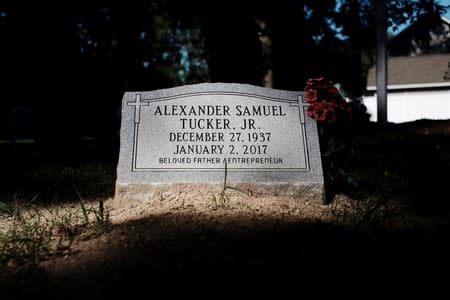 A flower lays on a grave in the Tucker family cemetery in Hampton, Virginia