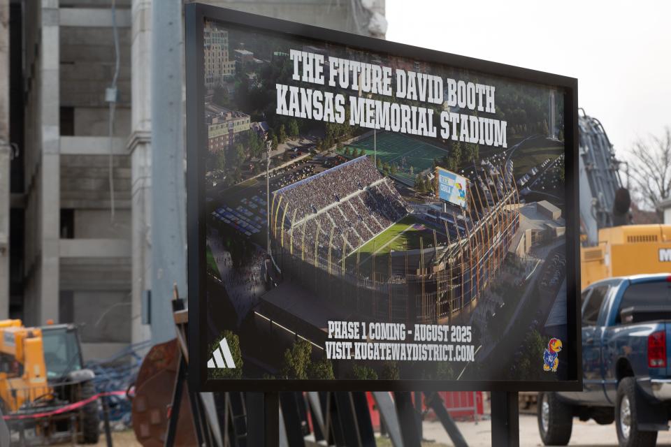 A rendering of what the future David Booth Kansas Memorial Stadium will look like is seen on the northwest corner of the stadium as demolition of the current facility is underway.