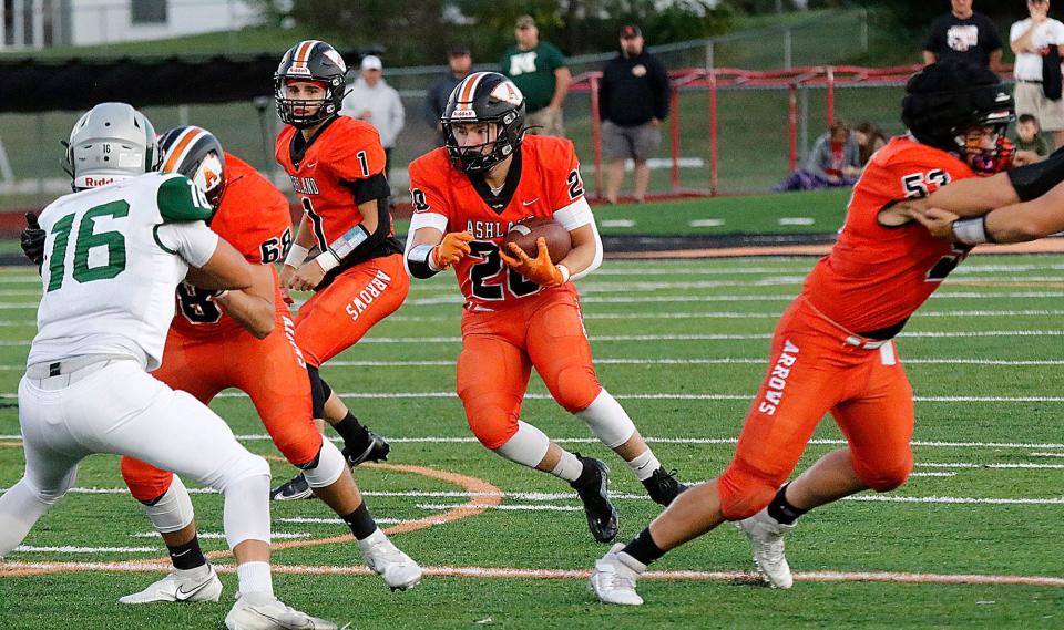 Ashland High School's Cayden Spotts (20) carries the ball against Madison High School during high school football action Friday, Sept. 22, 2021 at Ashland Community Stadium. TOM E. PUSKAR/TIMES-GAZETTE.COM