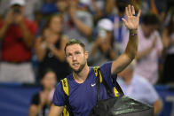 Jack Sock, of the United States, waves to the crowd after a loss to Rafael Nadal, of Spain, in the Citi Open tennis tournament Wednesday, Aug. 4, 2021, in Washington. (AP Photo/Nick Wass)