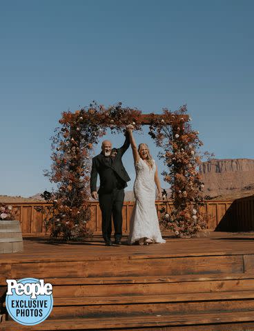 <p>Dani Sork Photo</p> Christine Brown and David Woolley celebrate after tying the knot.