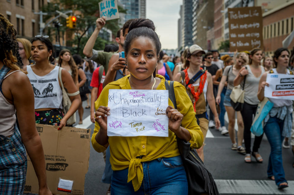 About two thousand New Yorkers marched in Manhattan bringing traffic to a halt for many hours to remember Delrawn Small, Alton Sterling and Philando Castile, the three men shot dead by police in the last three days.