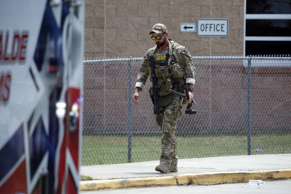A Texas State Police officer walks outside Robb Elementary School following a shooting, Tuesday, May 24, 2022, in Uvalde, Texas. (AP Photo/Dario Lopez-Mills)