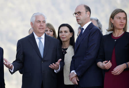 U.S. Secretary of State Rex Tillerson (L) gestures as he talks with Italy's Foreign Minister Angelino Alfano (C) and E.U. High Representative for Foreign Affairs Federica Mogherini (R) during a ceremony at the Sant'Anna di Stazzema memorial, dedicated to the victims of the massacre committed in the village of Sant'Anna di Stazzema by the Nazis in 1944 during World War II, Italy April 10, 2017. REUTERS/Max Rossi