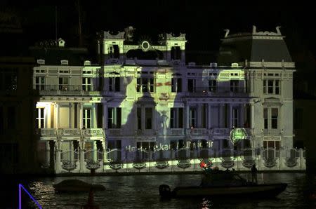 An image of the deposed Egyptian president Mohamed Mursi is projected on the Egyptian Consulate during a protest against an Egyptian court's decision to sentence him to death, in Istanbul, Turkey, late June 16, 2015. REUTERS/Murad Sezer