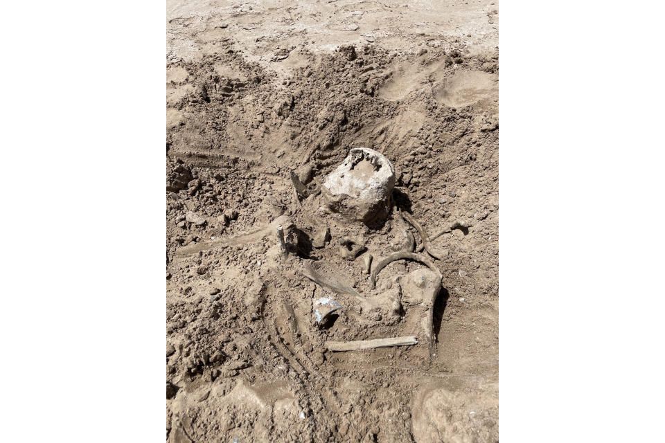 This photo of Saturday, May 7, 2022, provided by Lindsey Melvin of Henderson, Nev., shows human remains she and her sister discovered on a sandbar that recently surfaced as Lake Mead recedes. A closer look revealed a human jaw with teeth. The National Park Service confirmed in a statement that the remains are human. (Lindsey Melvin via AP)