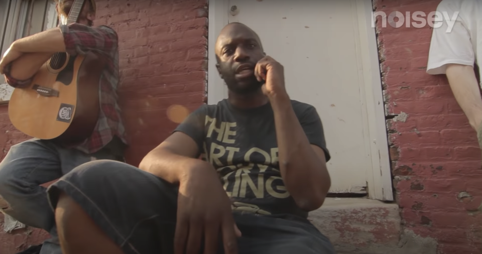 Malik B. pictured in a 2012 music video with Mr Green.