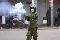 Kenya anti riot police fires a teargas canister towards protesters in Nairobi, Kenya Thursday, June 27, 2024. Kenyan police on Thursday clashed with protesters in Nairobi before planned protests against a contentious finance bill, despite the president's decision not to sign it after the plans sparked deadly chaos in the capital and saw protesters storming and burning part of the parliament building. (AP Photo/Brian Inganga)