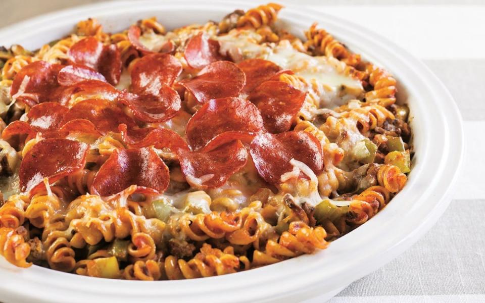 <p>Sarah Hone</p><p>Can't decide on pizza or pasta? Try both in this speedy supper inspired by everyone’s favorite food. The comforting <a href="https://parade.com/882535/stephaniebrubaker/cheesy-creamy-baked-pasta-recipes/" rel="nofollow noopener" target="_blank" data-ylk="slk:baked pasta recipe;elm:context_link;itc:0;sec:content-canvas" class="link ">baked pasta recipe</a> is loaded with whole-wheat pasta, lean <a href="https://www.yahoo.com/lifestyle/150-ground-beef-recipes-dinner-133027676.html" data-ylk="slk:ground beef;elm:context_link;itc:0;sec:content-canvas;outcm:mb_qualified_link;_E:mb_qualified_link;ct:story;" class="link  yahoo-link">ground beef</a> and <a href="https://www.yahoo.com/lifestyle/long-does-cook-perfect-turkey-183936104.html" data-ylk="slk:turkey;elm:context_link;itc:0;sec:content-canvas;outcm:mb_qualified_link;_E:mb_qualified_link;ct:story;" class="link  yahoo-link">turkey</a> pepperoni, so you'll feed good serving it to your kids. </p><p><strong>Get the recipe: <a href="https://parade.com/958601/parade/make-ahead-supreme-pizza-pasta-casserole/" rel="nofollow noopener" target="_blank" data-ylk="slk:Supreme Pizza Pasta Casserole;elm:context_link;itc:0;sec:content-canvas" class="link ">Supreme Pizza Pasta Casserole</a></strong></p>