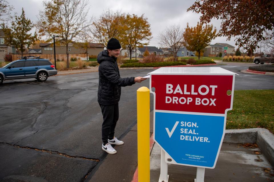 In this file photo, Emmet Pritchard of Fort Collins drops his ballot off at the ballot drop box at the Fort Collins Police Services building on Nov. 2, 2021.