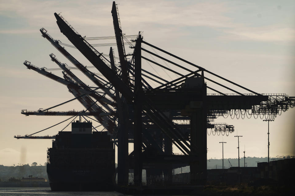 A docked container ship is seen at the Port of Los Angeles, Friday, April 28, 2023. A year ago, Los Angeles and Shanghai formed a partnership to create a green shipping corridor that would become a showcase for slashing planet-warming carbon emissions from the shipping industry, which produces about 3% of the world's total. The container shipping route is among the world’s busiest. (AP Photo/Damian Dovarganes)