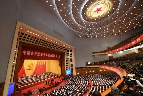 Delegates attending the closing of the 19th Communist Party Congress at the Great Hall of the People in Beijing - Credit: GREG BAKER/AFP/Getty Images