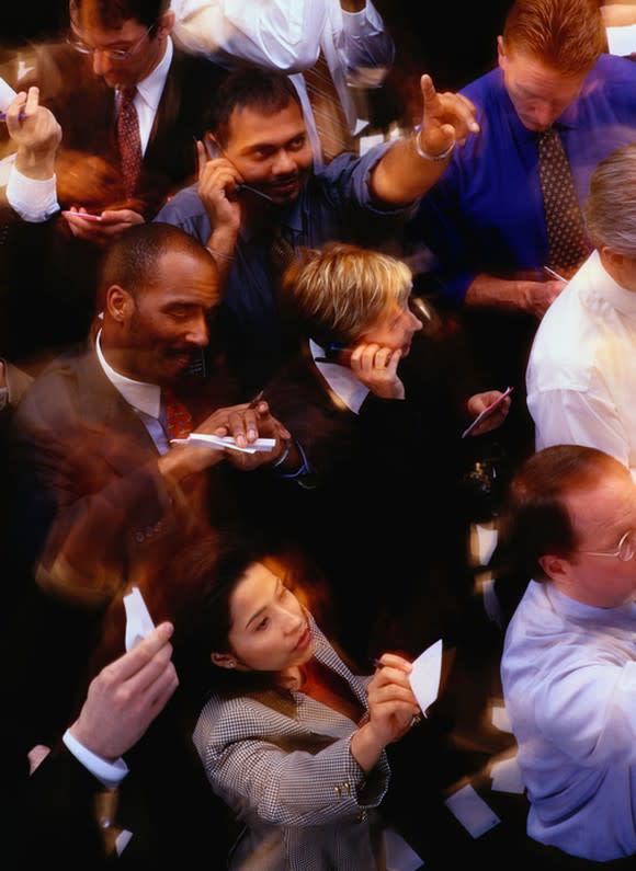 Floor traders bidding shares on a stock exchange