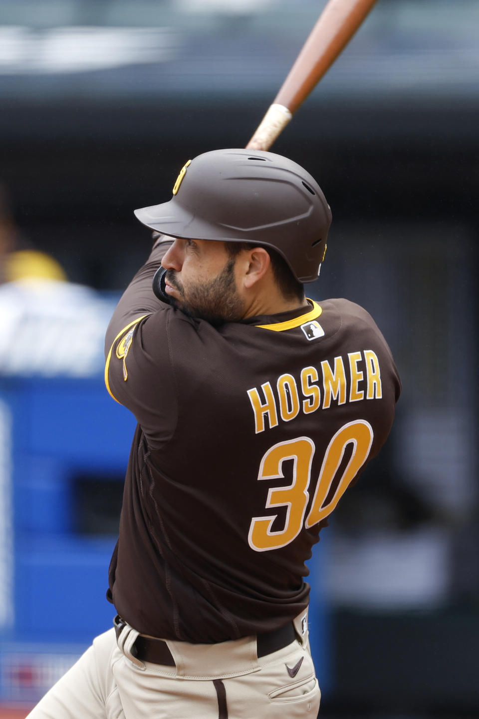 San Diego Padres' Eric Hosmer hits an RBI single against the Cleveland Guardians during the first inning in the first baseball game of a doubleheader, Wednesday, May 4, 2022, in Cleveland. (AP Photo/Ron Schwane)