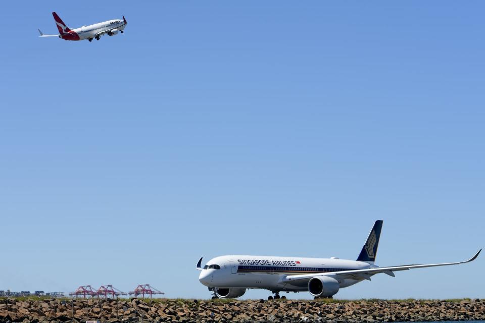 Passenger planes taking off and landing.