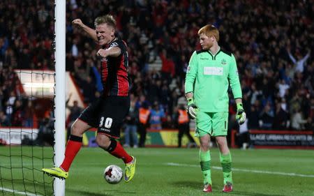 Football - AFC Bournemouth v Bolton Wanderers - Sky Bet Football League Championship - Goldsands Stadium, Dean Court - 27/4/15 Matt Richie celebrates after Callum Wilson (not pictured) scored the third goal for Bournemouth as Bolton's Adam Bogdan looks dejected Mandatory Credit: Action Images / Matthew Childs