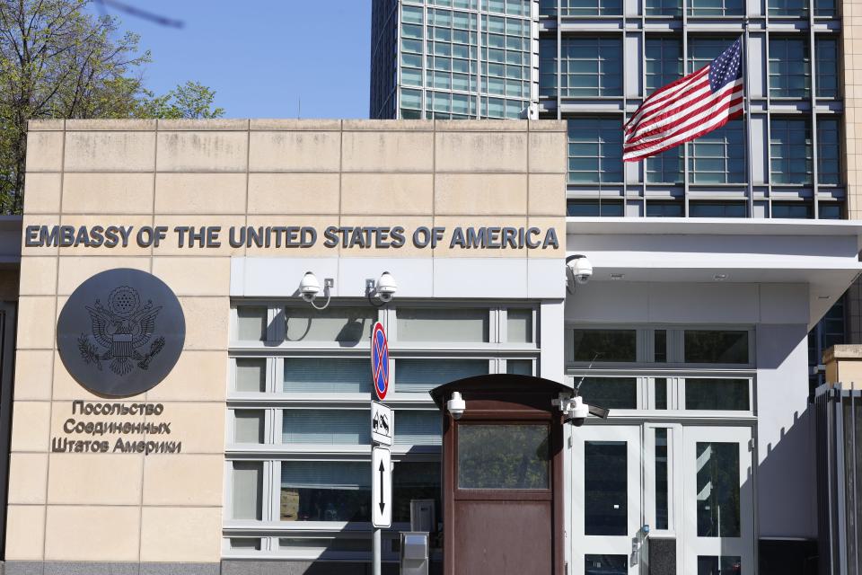 FILE In this file photo taken on Tuesday, May 11, 2021, The U.S. Embassy and the National flag are seen in Moscow, Russia. Today was the last day of work for all locally employed staff at the US embassy in Moscow, which is a big blow and a sign the Russians aren't willing to back down even after Biden-Putin meeting in Geneva last month and Sherman-Ryabkov in Geneva earlier this week. (AP Photo/Alexander Zemlianichenko, File)