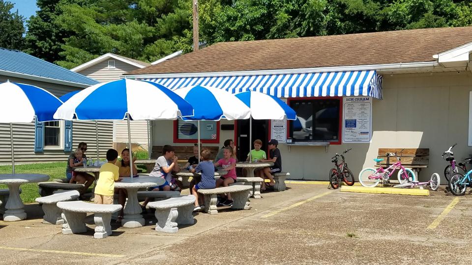 Diners gather to enjoy ice cream, burgers and sandwiches at the Rivertown Ice Cream and Grill. Stop in before the walk-up restaurant closes after August 27.