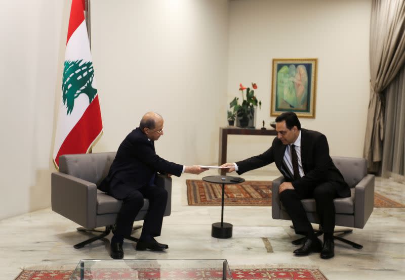 Lebanon's Prime Minister Hassan Diab submits his resignation to Lebanon's President Michel Aoun at the presidential palace in Baabda