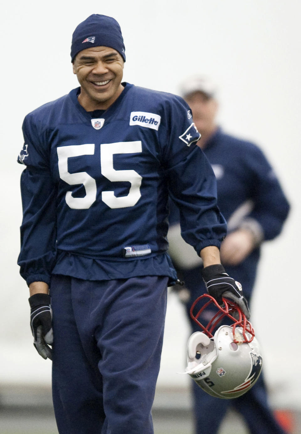 New England Patriots linebacker Junior Seau laughs during practice at the NFL football team's facility in Foxborough, Mass., on Wednesday, Dec. 30, 2009. (AP Photo/Gretchen Ertl)