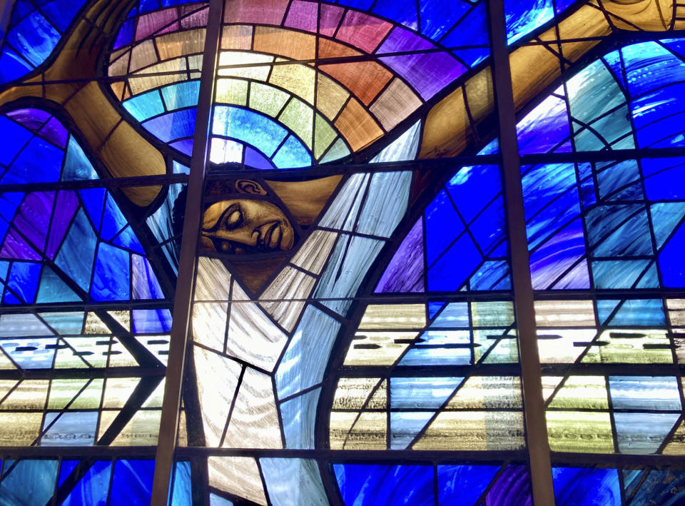 FILE - The "Wales Window" decorates a window inside 16th Street Baptist Church, March 4, 2022, in Birmingham, Ala. The window was a donation from the people of Wales following a racist bombing that killed four Black girls at the church. Alabama on Friday, Sept. 15, 2023, will mark the 60th anniversary of the bombing that killed four girls. Lisa McNair, the sister of one of the victims, said as the anniversary is remembered, she hoped people will think about what they can do to combat hate. (AP Photo/Jay Reeves, File)