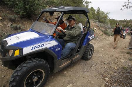 Phil Lyman, a San Juan County commissioner, drives his all-terrain vehicle in Recapture Canyon outside Blanding, Utah, May 10, 2014. REUTERS/Jim Urquhart