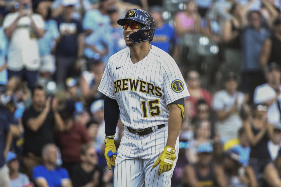 Milwaukee Brewers' Tyrone Taylor celebrates at home plate after his home run during the sixth inning of a baseball game against the Colorado Rockies, Sunday, July 24, 2022, in Milwaukee. (AP Photo/Kenny Yoo)