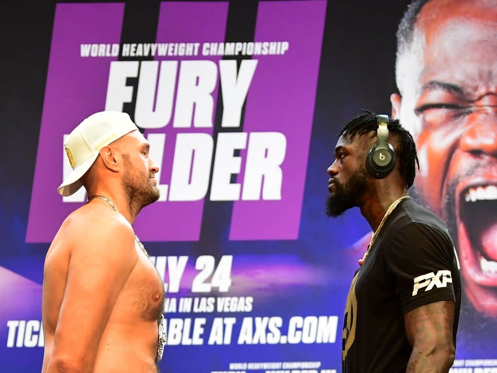 Tyson Fury (left) and Deontay Wilder face off ahead of their trilogy fight (AFP via Getty Images)