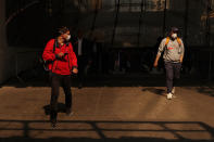 <p>Men wearing protective face masks leave Penn Station during warnings by officials of heavy pollution after thick haze and smoke caused by wildfires in Canada covered the area, in New York City, U.S., June 8, 2023. REUTERS/Shannon Stapleton</p> 