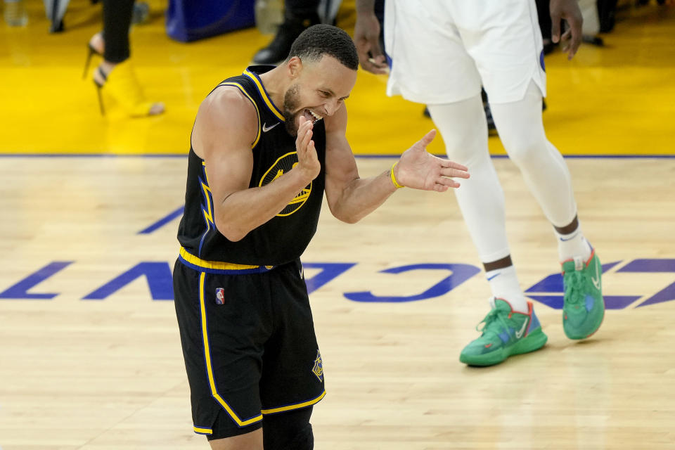 Stephen Curry celebrates after shooting a three against the Dallas Mavericks in Game One of the 2022 NBA Playoffs Western Conference Finals. (Photo by Thearon W. Henderson/Getty Images)