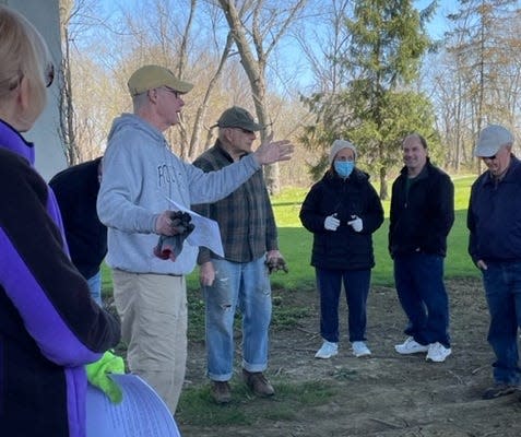 Fr. Tim Taugher, of St. Francis of Assisi Roman Catholic Church, speaks at a tree planting April 30 at Port Dickinson Community Park.