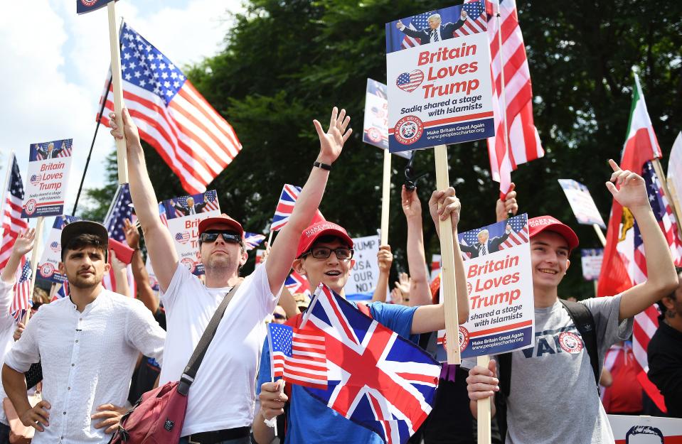 <p>People demonstrate outside the U.S. Embassy in London in support of President Trump’s visit to the U.K., July 14, 2018. (Photo: Andy Rain/EPA-EFE/REX/Shutterstock) </p>