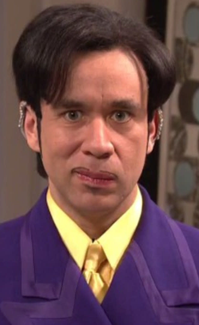 Armisen wearing Prince's signature purple suit, earrings, thin mustache