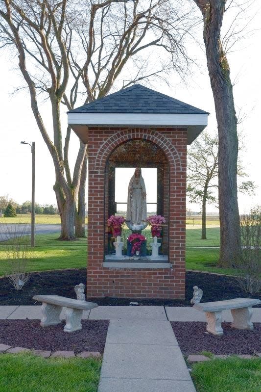A grotto dedicated to the Blessed Virgin Mary sits on the grounds of the St. Joseph Catholic Church in Erie.