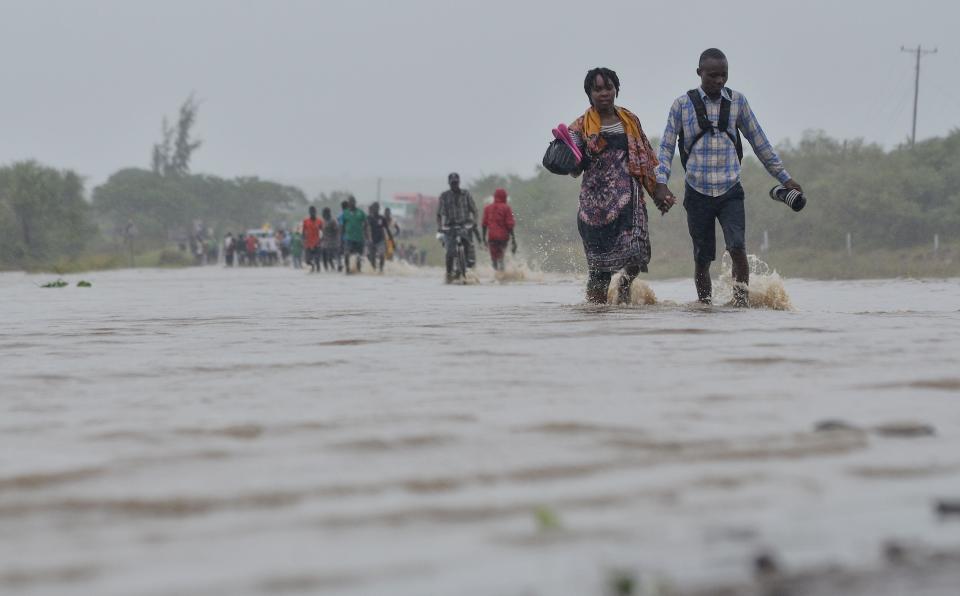 Residents brave the floods in Mazive, southern Mozambique, on April 28, 2019, after a cyclone brought heavy rains. (Photo: EMIDIO JOSINE via Getty Images)