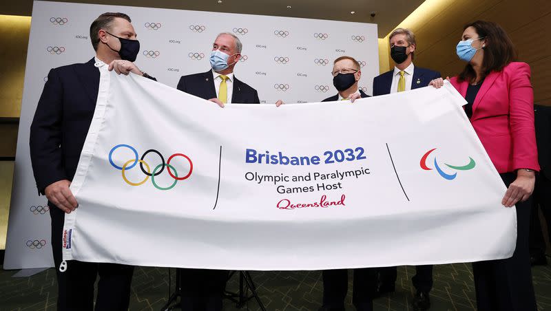 Lord Mayor of Brisbane, Councillor Adrian Schrinner, Sen. Richard Colbeck, Minister for Senior Australians and Aged Care Services and Minister for Sport, John Coates AC, President, Australian Olympic Committee, three-time Olympic gold medalist James Tomkins and Tannastacia Palaszczuk MP, Premier of Queensland and Minister for Trade, attend a press conference after Brisbane was announced as the 2032 Summer Olympics host city during the IOC Session at Hotel Okura in Tokyo, July 21, 2021.