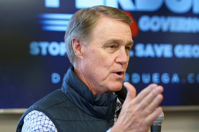 FILE PHOTO: Former Republican U.S. Senator David Perdue campaigns for Governor in Covington